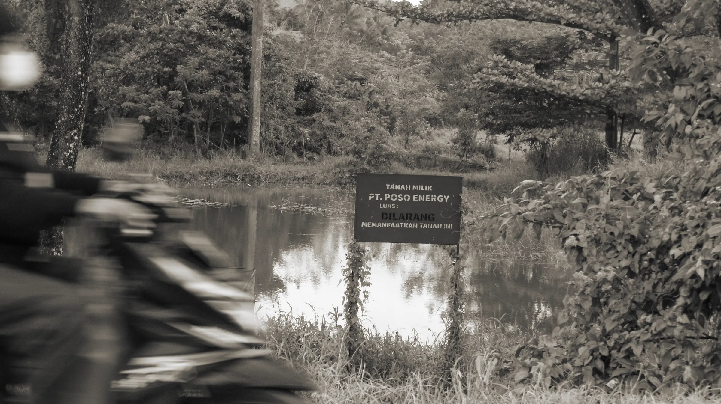 Warning signs of Poso Energy land enclosure, Sulewana village. Source: personal documentation, July 2026.